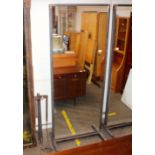 A full length double sided mirror on industrial de