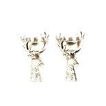 A pair of silvered stag wine coolers, 33cm high