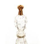 A cut glass baluster scent bottle with yellow meta