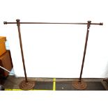 A cast iron industrial style clothes rail raised o