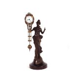 A bronzed swing clock in the form of classical mai