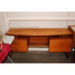 A teak G-plan dressing table of curved form with r