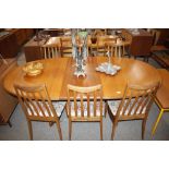 A teak G-plan extending dining table with extra le