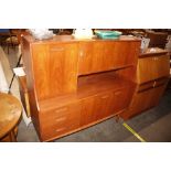 A teak sideboard, the upper section fitted shelves