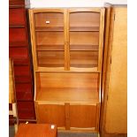 A teak wall unit, 92cm wide x 179cm high