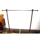 A cast iron industrial design clothes rail raised