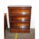 An oak Inglesants three section bookcase Reg. No.