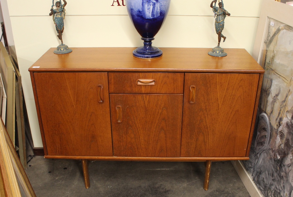 A teak G-plan sideboard fitted central drawer and