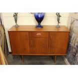 A teak G-plan sideboard fitted central drawer and