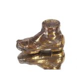 A brass vesta case in the form of a boot