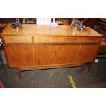 A teak G-plan design sideboard fitted three drawer