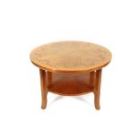 A light oak circular two tier coffee table with Gr