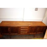 A large teak G-plan design sideboard fitted four c