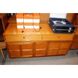 A Nathan teak sideboard, having central pull out d