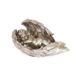 A decorative silvered cherub ornament