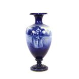 A large late 19th Century Royal Doulton blue glazed vase of baluster form, decorated country scenes