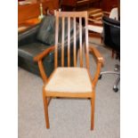 A teak rail back elbow chair, raised on square sec