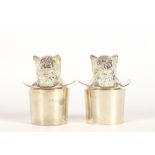 A pair of plated cruets in the form of cats in top