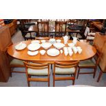 A teak G-plan style extending dining table with ex