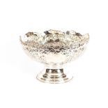 A large plated punch bowl, having vine decoration,