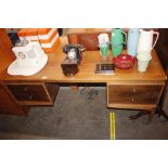 A teak Uniflex kneehole desk, 153cm wide x 46cm de
