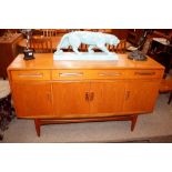 A teak G-plan sideboard, fitted three long drawers