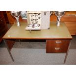 A teak kneehole writing desk with leatherette inse