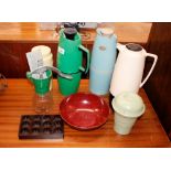 A collection of Bakelite and plastic Thermos jugs