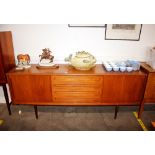 A teak G-plan design long sideboard fitted four ce