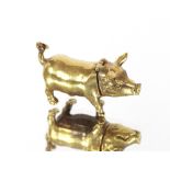 A brass pig vesta case