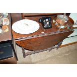 An 18th Century gate leg dining table fitted singl