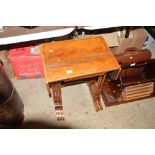 A nest of three mahogany occasional tables