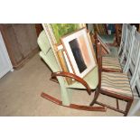 A bentwood and green upholstered rocking chair