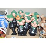 A collection of Avon Andy Capp dispensers
