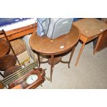 An Edwardian mahogany and inlaid oval table