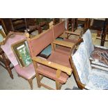 A pair of carved wooden leather carver chairs (ven