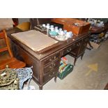 An early 20th Century mahogany writing desk with l