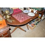 A reproduction mahogany D end dining table with on