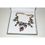 A boxed Diamanté black stone set costume necklace