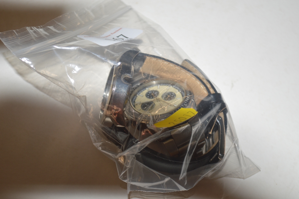 A DKNY wrist watch; and a watch case