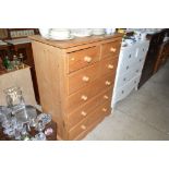 A modern pine chest fitted two short over four lon