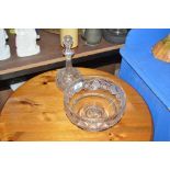 A glass pedestal bowl and a glass decanter