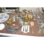 A pair of brass candlesticks; silver plated trays;
