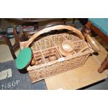 A wicker bottle carrier together with turned woode