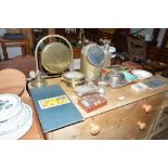 A brass dinner gong on stand; a brass cased gimbal