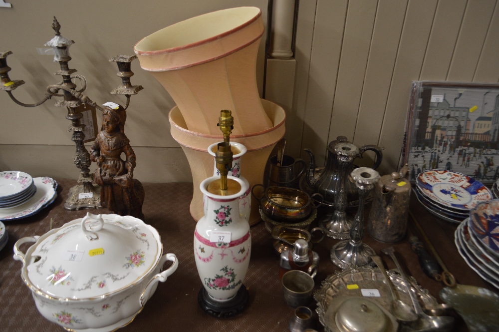 A pair of rose decorated china table lamps with sh