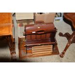 A reproduction mahogany magazine rack; a leather s