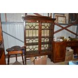 A 19th Century mahogany bookcase raised on square