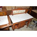 An Edwardian satinwood marble topped wash stand