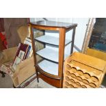 An Edwardian mahogany bowfront display cabinet